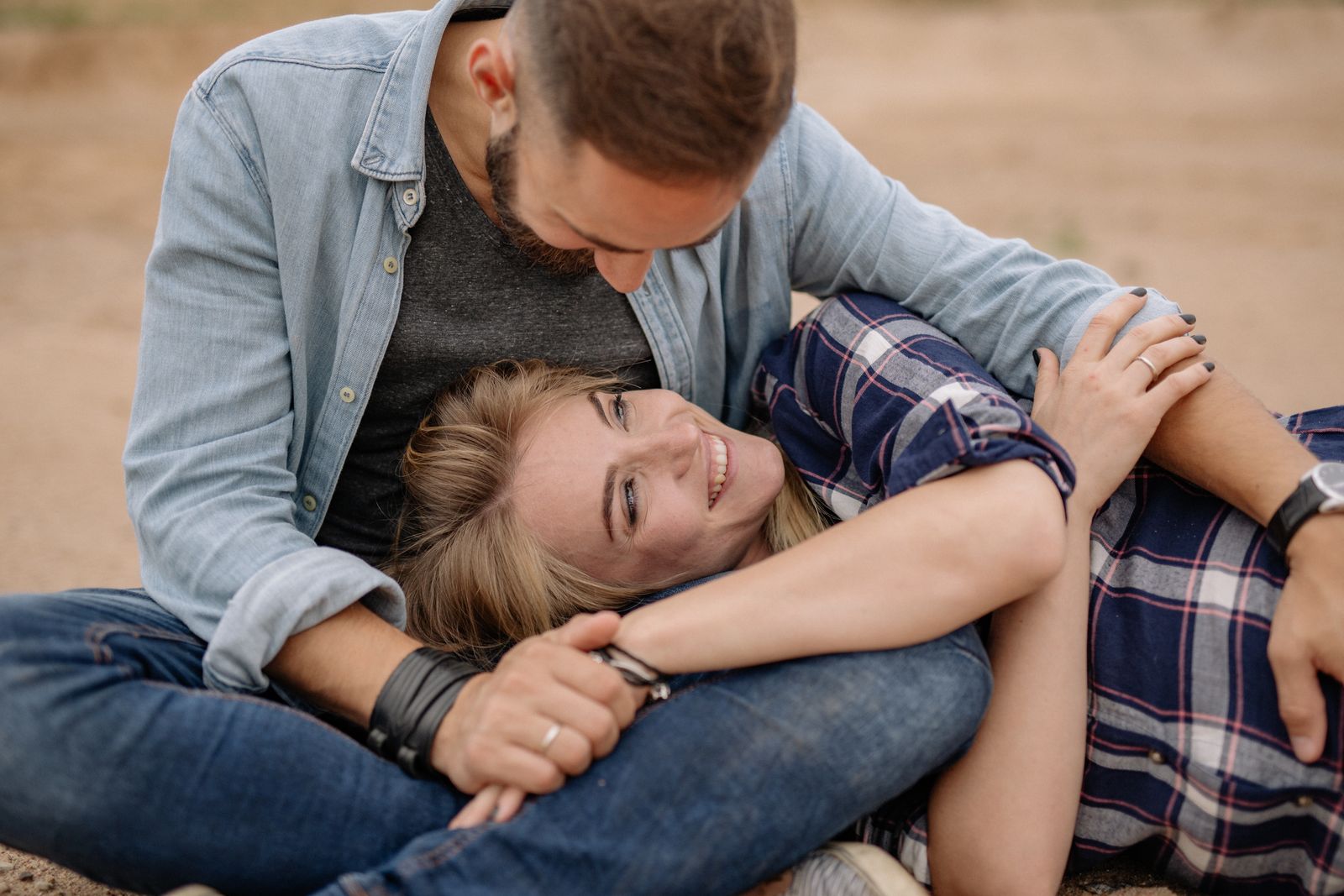 A couple relaxing and laughing together outdoors
